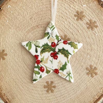 Star decoration with holly and mistletoe pattern