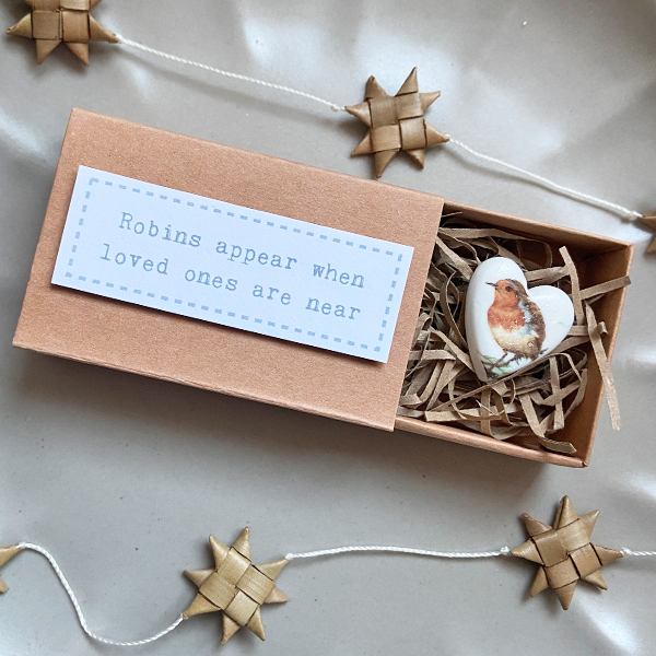 Porcelain matchbox token robins appear when loved ones are near