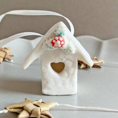 Mini house decoration with holly